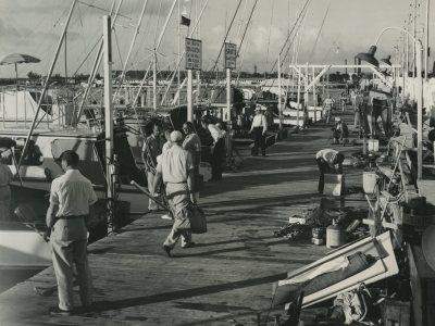 Vintage photo of men walking on the marina